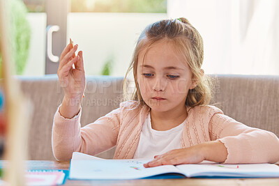 Buy stock photo Homework, education and girl with focus, notebook and thinking in living room, studying and learning. Female child, person and student with knowledge, development and ideas for activity and writing