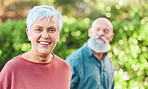 Nature, happy and portrait of a senior woman on an outdoor walk with her husband for health and wellness. Happiness, smile and face of a elderly female person in retirement walking in garden or park.