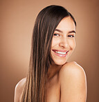 Hair care, beauty and portrait of woman in studio for wellness, treatment and health on brown background. Salon aesthetic, smile and face of happy girl with cosmetics, hairstyle and natural glow