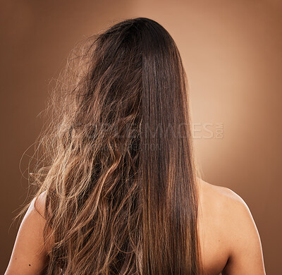 Buy stock photo Frizz, heat damage and hair of a woman isolated on a brown background in a studio. Back, salon treatment and lady showing results from keratin treatment, before and after a hairdresser procedure