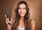 Hair care, flat iron and portrait of happy woman on studio background, smile on face and salon hairstyle. Haircare shine, electric straightener and happiness, latino model with spa heat treatment.