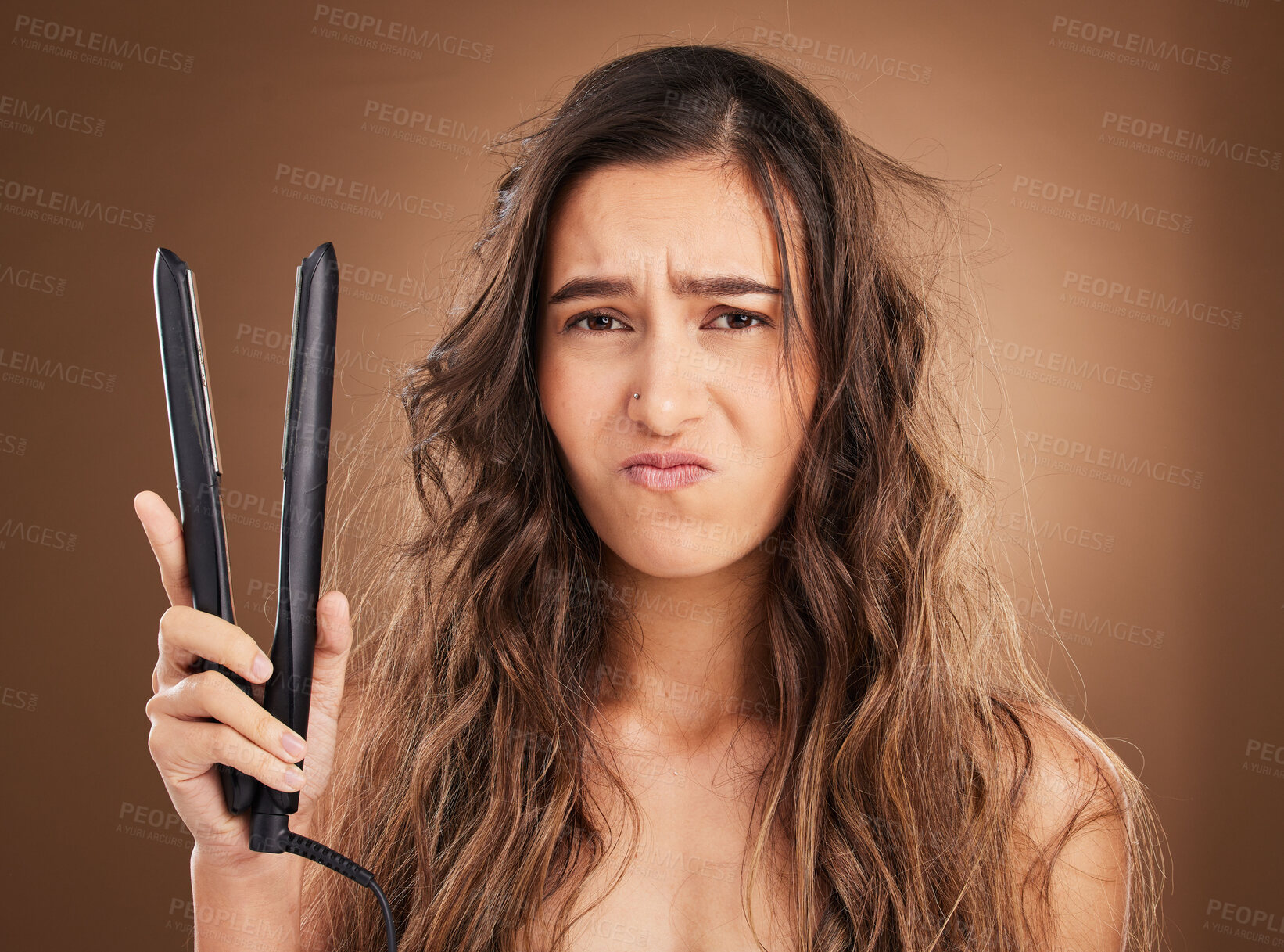 Buy stock photo Hair care, electric straightener and portrait of sad woman on studio background, worried face and dry salon hairstyle. Haircare damage, flat iron and frustrated latino model with spa heat treatment.