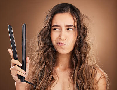 Buy stock photo Hair care, flat iron and damage, portrait of woman on studio background, worried face and salon hairstyle. Haircare problem, electric straightener and frustrated latino model with spa heat treatment.