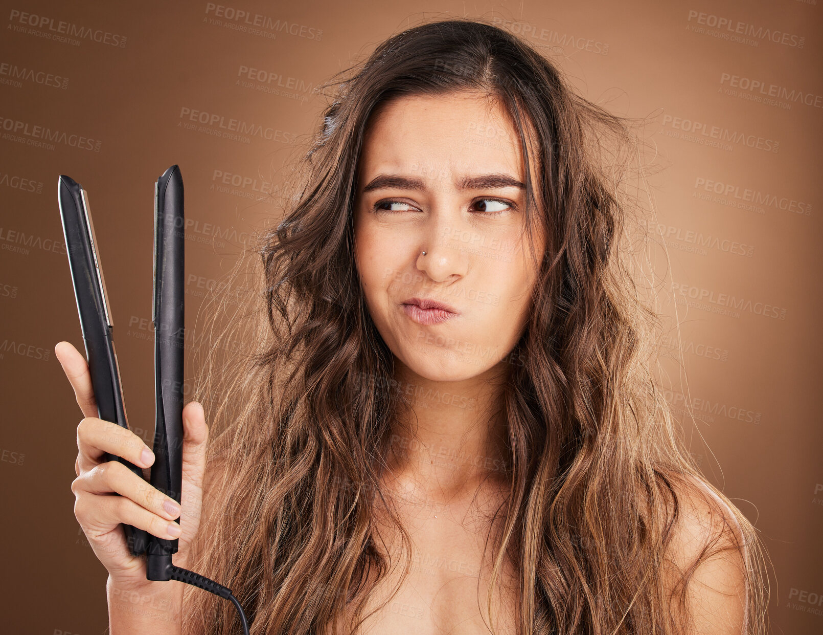 Buy stock photo Hair care, flat iron and damage, portrait of woman on studio background, worried face and salon hairstyle. Haircare problem, electric straightener and frustrated latino model with spa heat treatment.