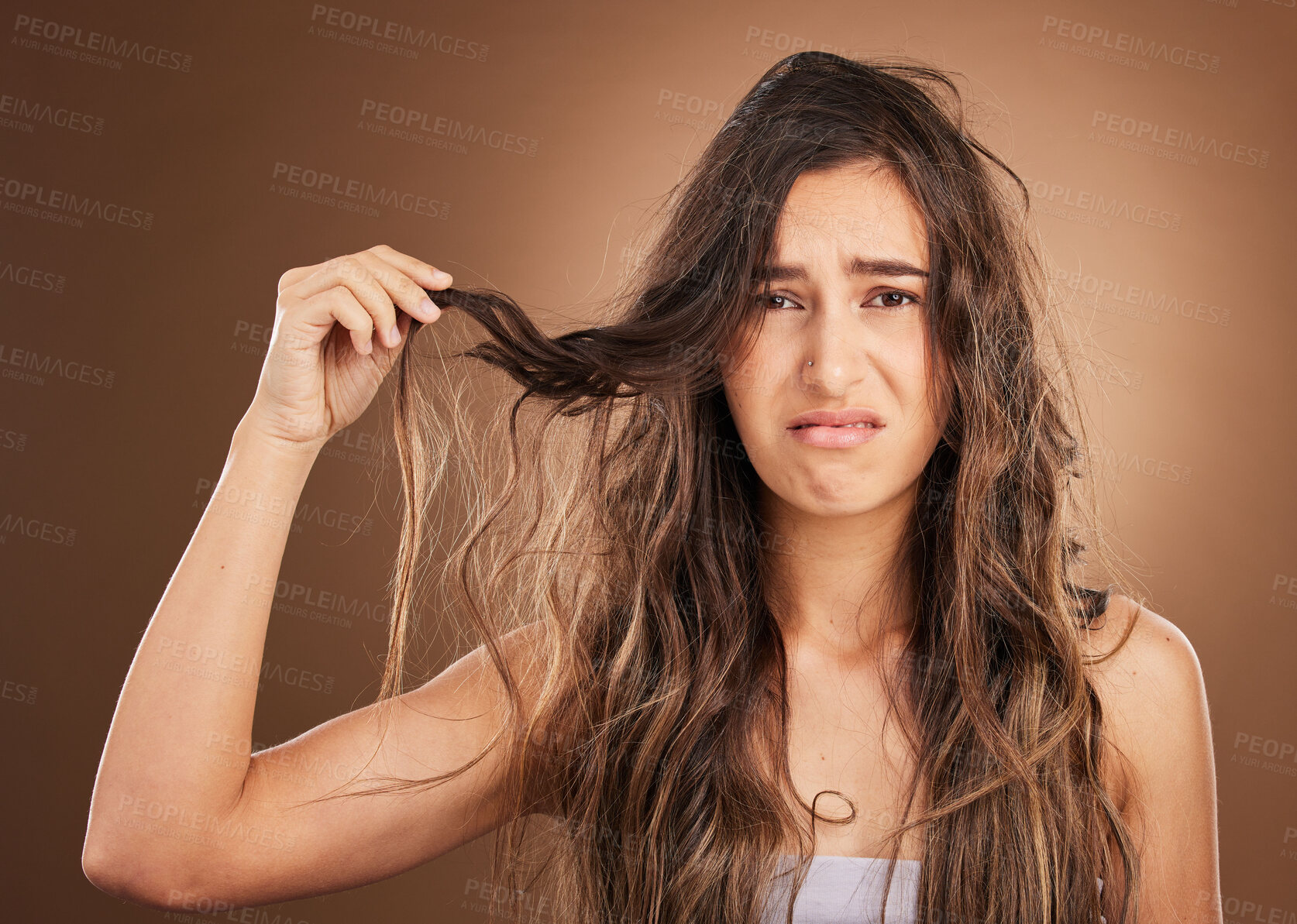 Buy stock photo Hair loss, problem and portrait woman in studio for beauty, messy and damage against brown background. Haircare, fail and face of sad girl frustrated with weak, split ends or tangle posing isolated