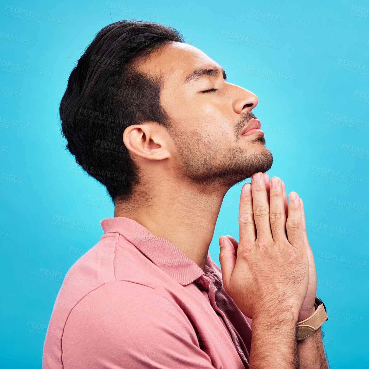 Buy stock photo Profile, religion and praying man in studio isolated on a blue background. Christian, spiritual and male person with prayer, gratitude and faith to worship God, Jesus and Holy Spirit with meditation.