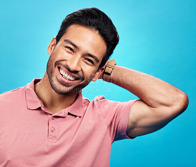 Buy stock photo Smile, happy and portrait of Asian man on blue background with pride, confidence and happiness. Fashion, confident and face of isolated male in studio with style, relaxing and excited expression