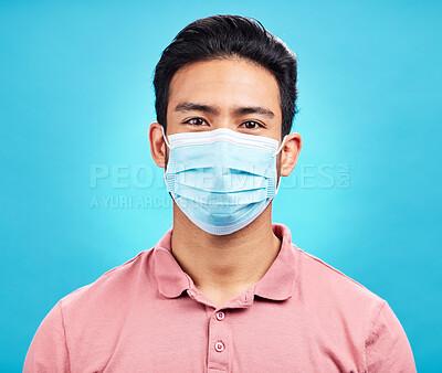 Buy stock photo Man in face mask, portrait and covid with safety from virus, bacteria and germs isolated on blue background. Disease, corona and male person, health compliance and rules with protection in studio