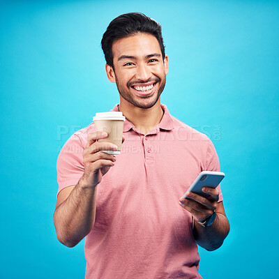 Buy stock photo Coffee, happiness and portrait of man with phone in studio isolated on a blue background. Tea, cellphone and smile of Asian person with drink, caffeine and mobile for social media or typing online.