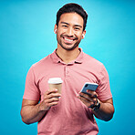 Earphones, coffee and portrait of man with phone in studio isolated on a blue background. Tea, cellphone and happiness of Asian person with drink, caffeine and mobile for social media, music or radio
