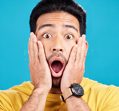 Buy stock photo Surprised, wow and portrait of shocked man face or emoji reaction to an announcement isolated in a blue studio background. OMG, fake news and male model with amazed facial expression in backdrop