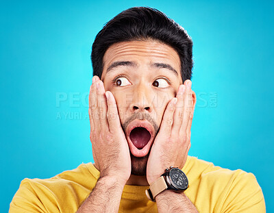 Buy stock photo Surprised, announcement and shocked face of a man or emoji reaction to a deal isolated in a blue studio background. OMG, fake news and male model with amazed facial expression in backdrop