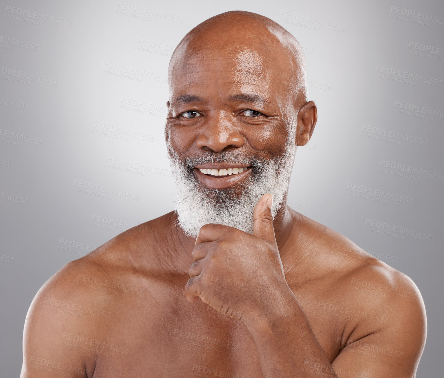 Buy stock photo Happy senior black man, portrait smile and skincare for personal hygiene or profile against a gray studio background. African American elderly male smiling with beard for healthy or perfect skin