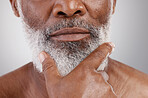 Senior man, closeup and beard in studio for skincare, grooming and beauty routine on grey background. Facial, hair and elderly male relax with cosmetics, treatment and dermatology or moustache growth