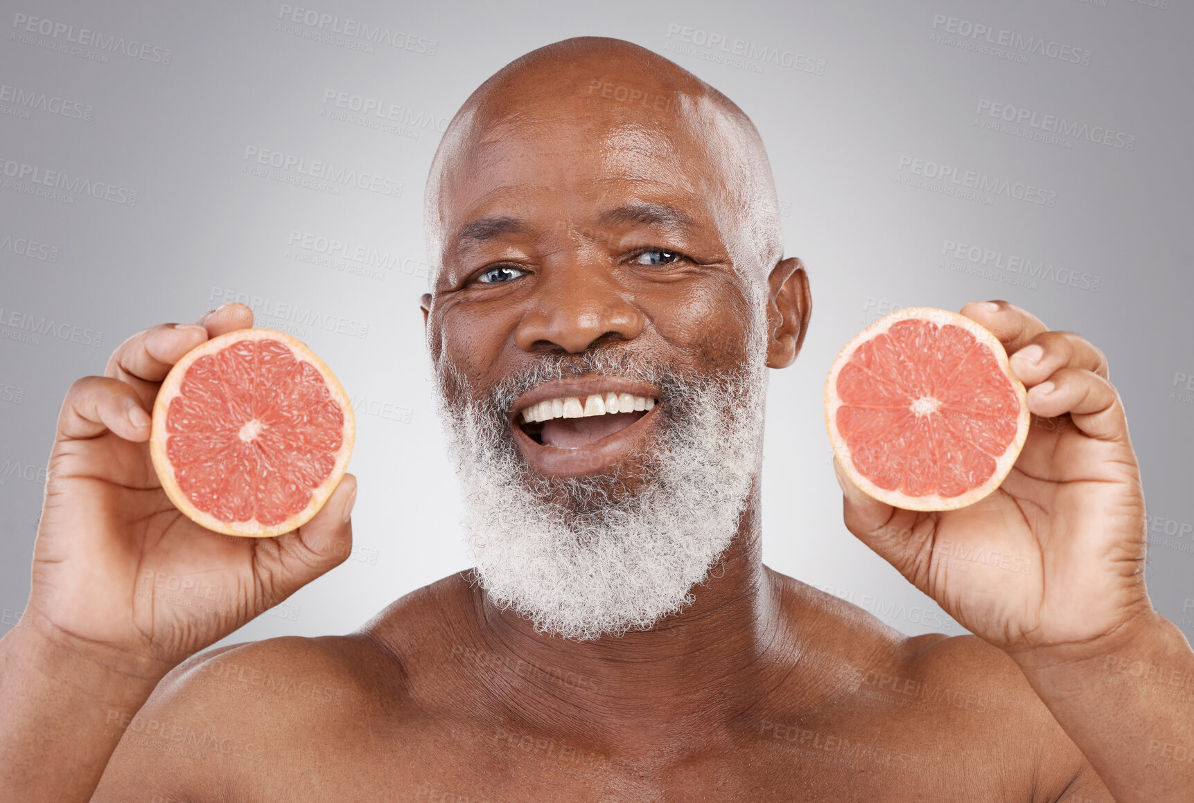 Buy stock photo Senior black man, grapefruit and smile for vitamin c, healthy skincare or natural nutrition against gray studio background. Portrait of happy African male with fruit for skin, healthcare or wellness