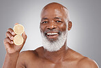 Senior black man, portrait smile and fruit for vitamin C, skincare or natural nutrition against gray studio background. Happy African American male and citrus lemon for healthy skin, diet or wellness