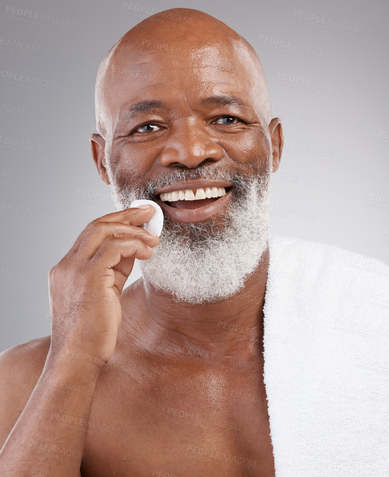 Buy stock photo Skincare, cotton pad and portrait of man with happiness, cleaning or luxury bathroom routine. Dermatology, cosmetic process and happy, mature African model and anti ageing morning cleansing treatment