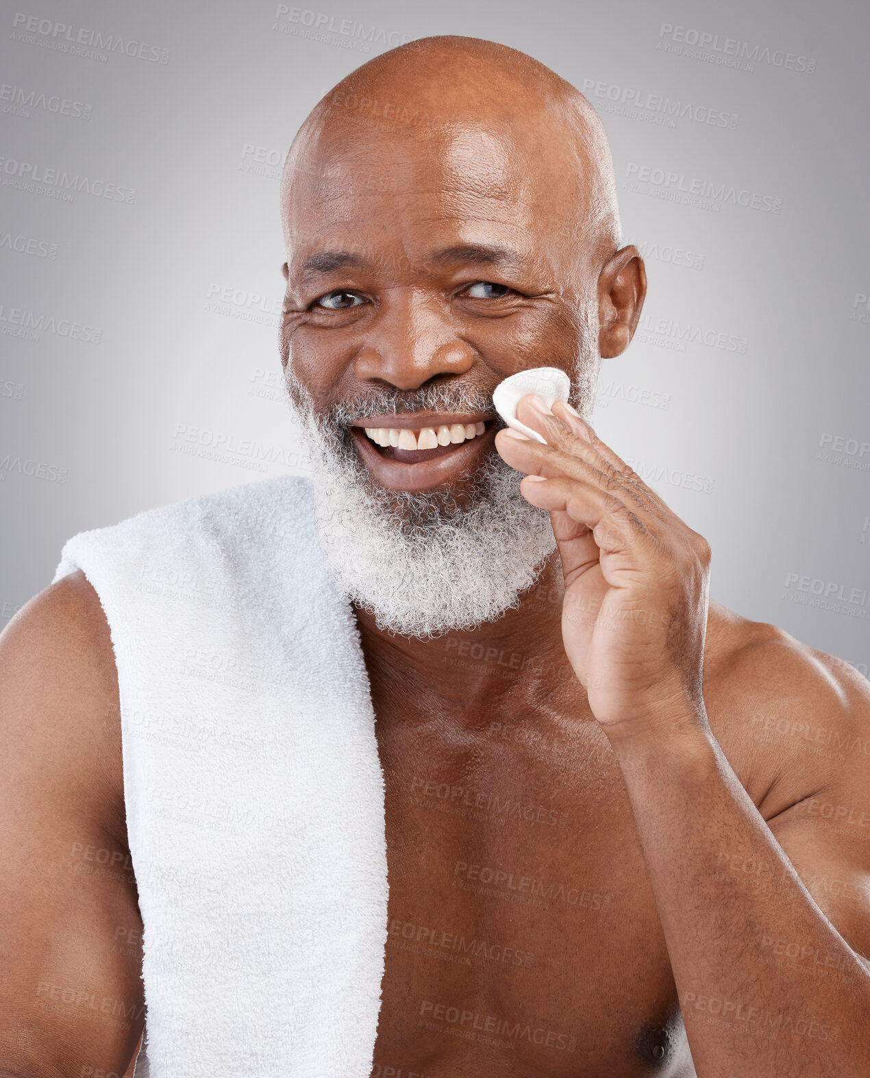 Buy stock photo Dermatology, cotton pad and portrait of black man with smile, happiness and anti ageing treatment in studio backdrop. Skin care, cosmetic and happy, mature model with morning skincare or face routine