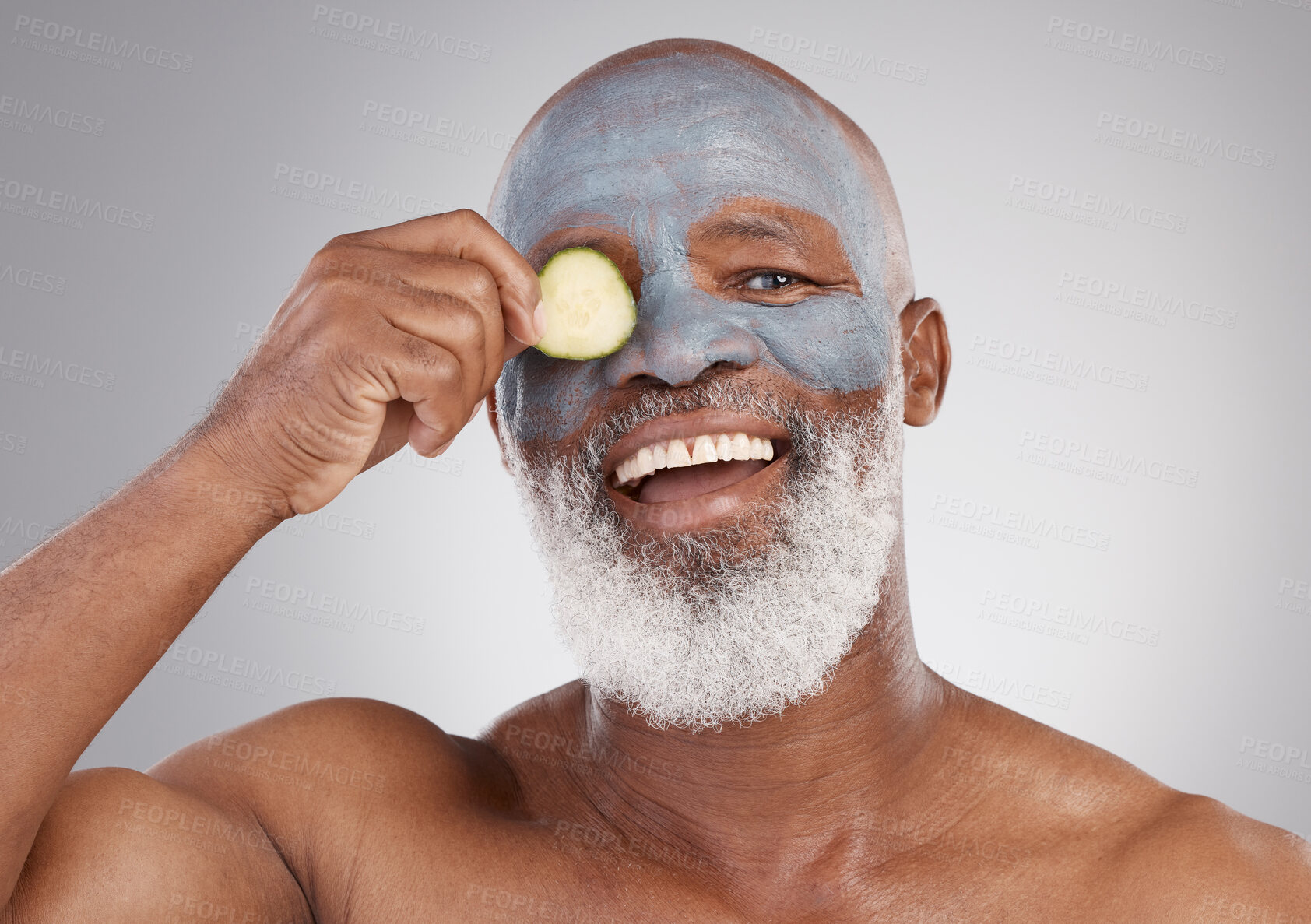 Buy stock photo Facial mask, cucumber and black man with smile in portrait, beauty and skincare isolated on studio background. Happy senior male, cosmetic care and healthy skin, anti aging cosmetics routine for face