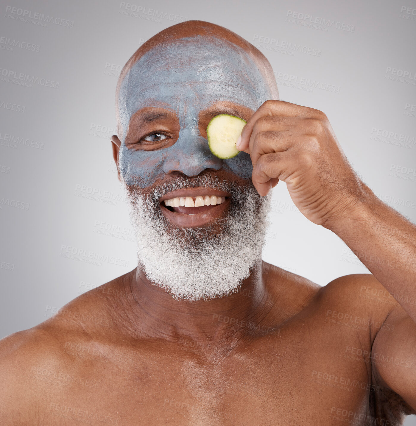 Buy stock photo Face mask, cucumber and black man with smile in portrait, beauty and skincare isolated on studio background. Happy senior male, cosmetics and healthy skin, anti aging cosmetic routine with facial