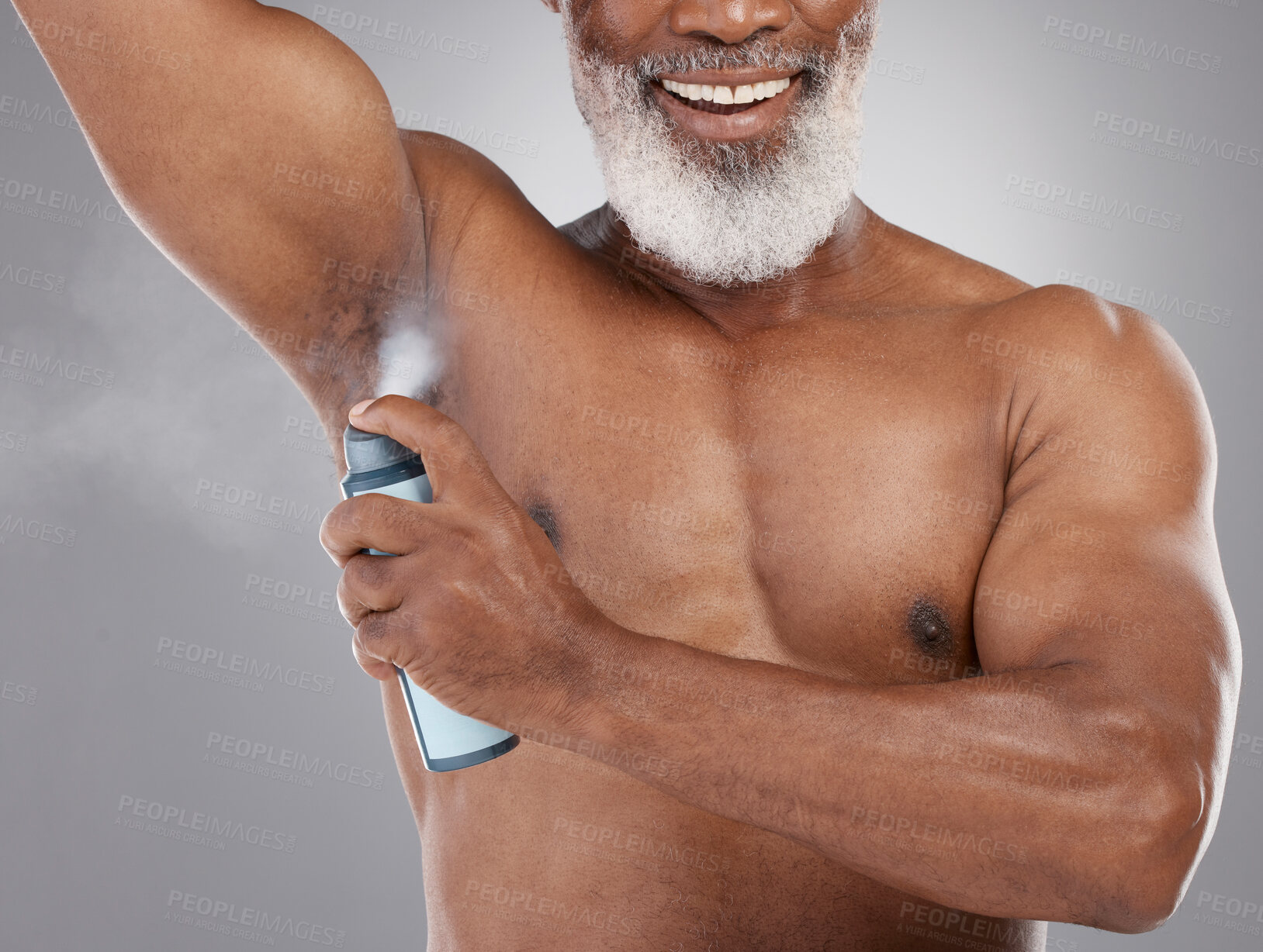 Buy stock photo Senior black man, deodorant and spraying armpit for personal hygiene, skincare or grooming against a gray studio background. Elderly African American male applying cosmetics for fresh or clean smell