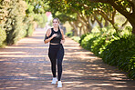 Music, fitness or woman running in park training, cardio exercise or full body workout for marathon. Sports, runner or healthy girl athlete exercising on jog streaming audio or radio song in nature