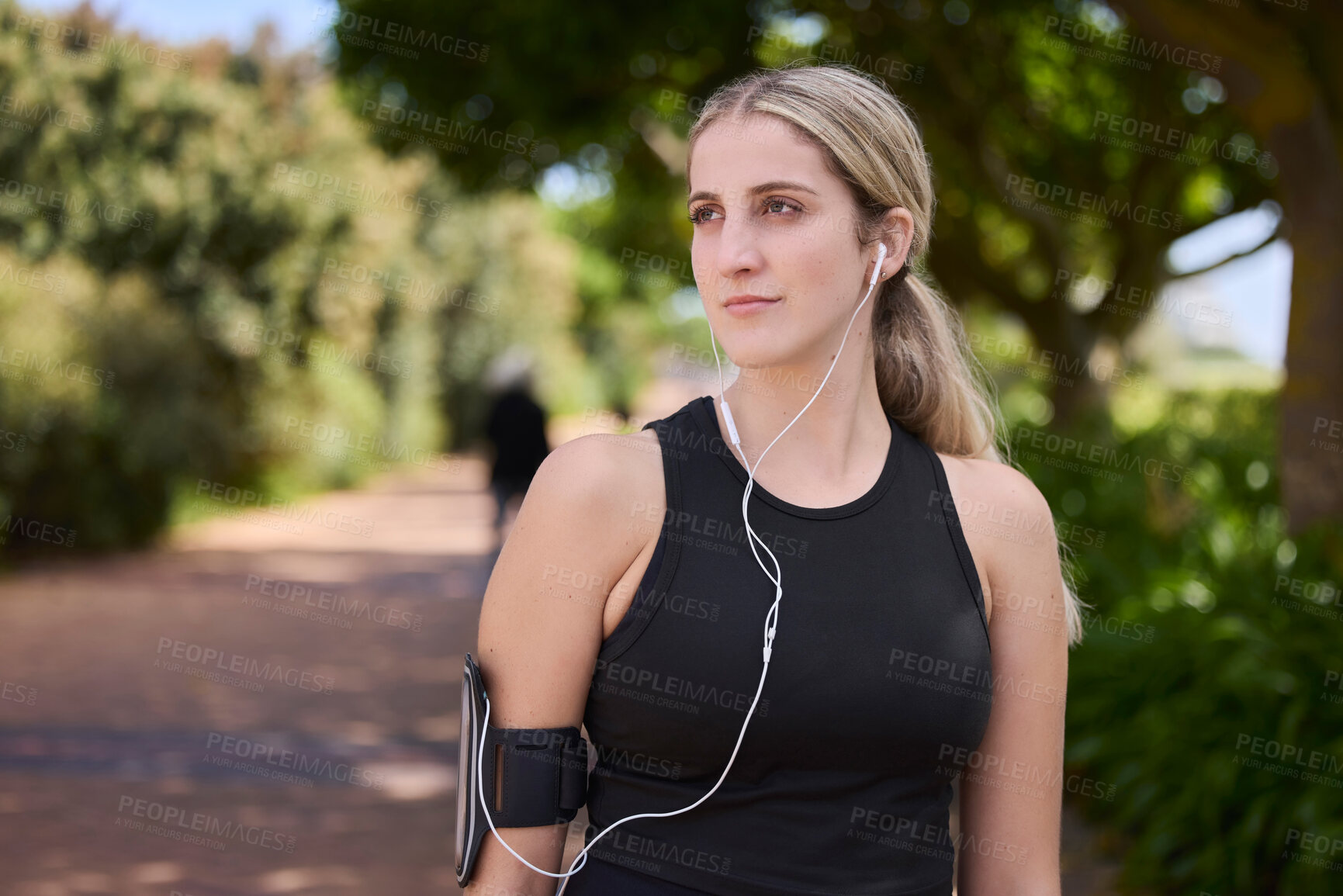 Buy stock photo Headphones, runner or woman thinking in park training, exercise or workout for a healthy body. Wellness, fitness break or sports girl athlete exercising or streaming audio or radio song in nature