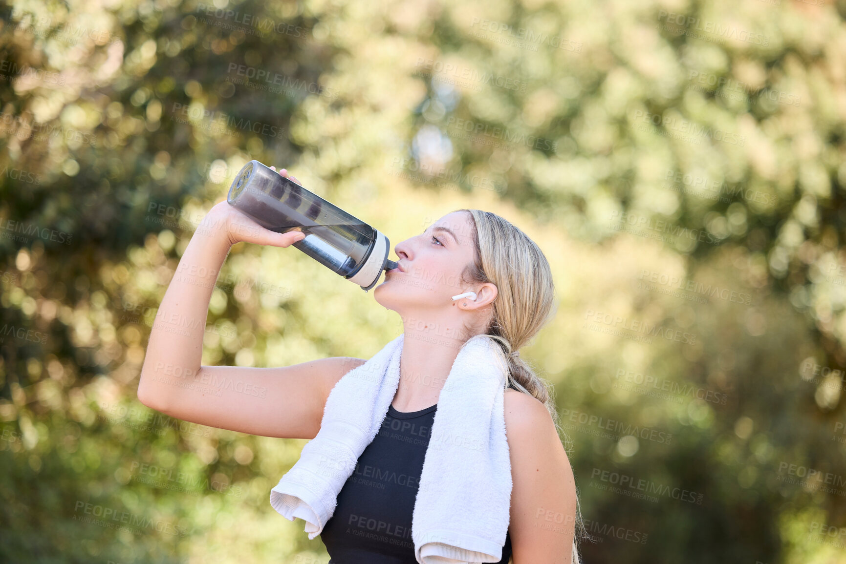 Buy stock photo Fitness, runner or girl drinking water in park to hydrate, relax or healthy energy on exercise break in nature. Tired thirsty athlete woman refreshing with liquid for hydration in training or workout