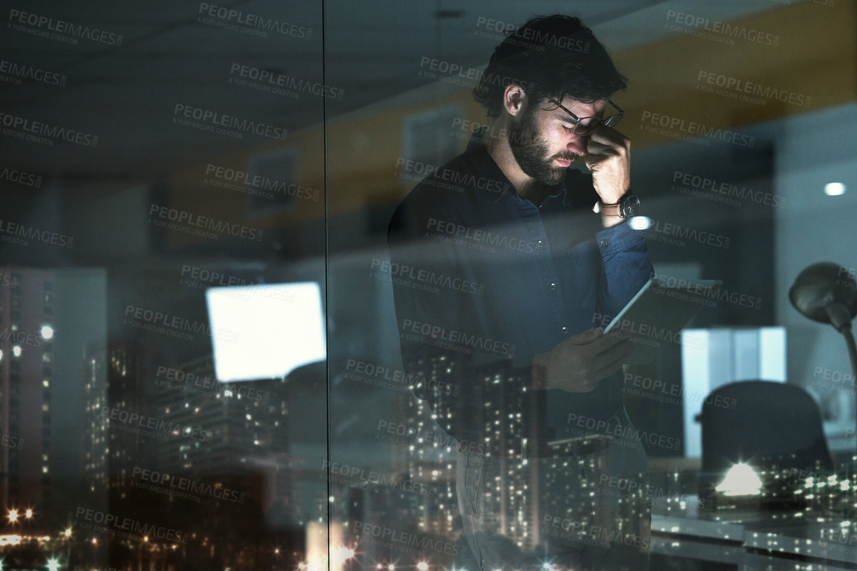 Buy stock photo Business man, tablet and headache, pain or migraine in office by widow with city lights at night. Technology, fatigue or person with depression, brain fog or anxiety, stress or burnout with deadline.