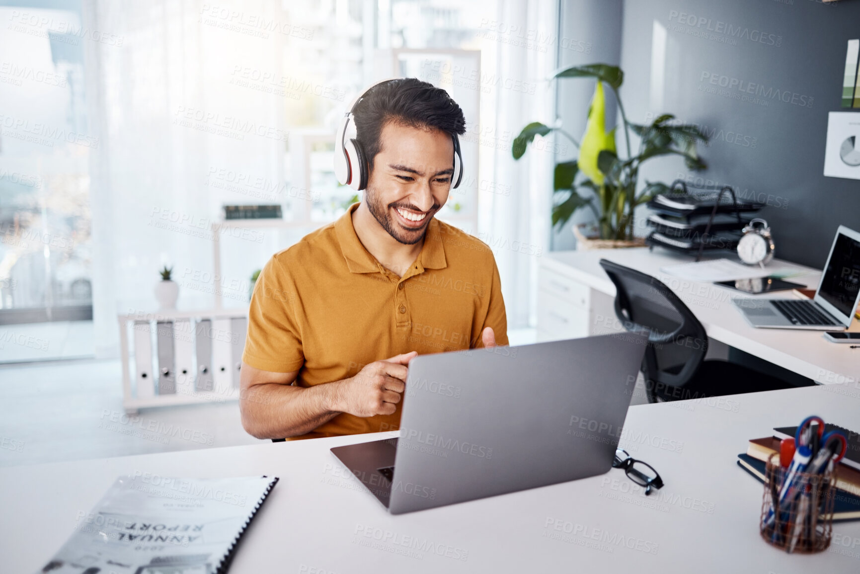 Buy stock photo Business man, laptop and headphones to listen to music, audio or webinar. Asian male entrepreneur at desk listening to a song or video call while online on social media with internet connection