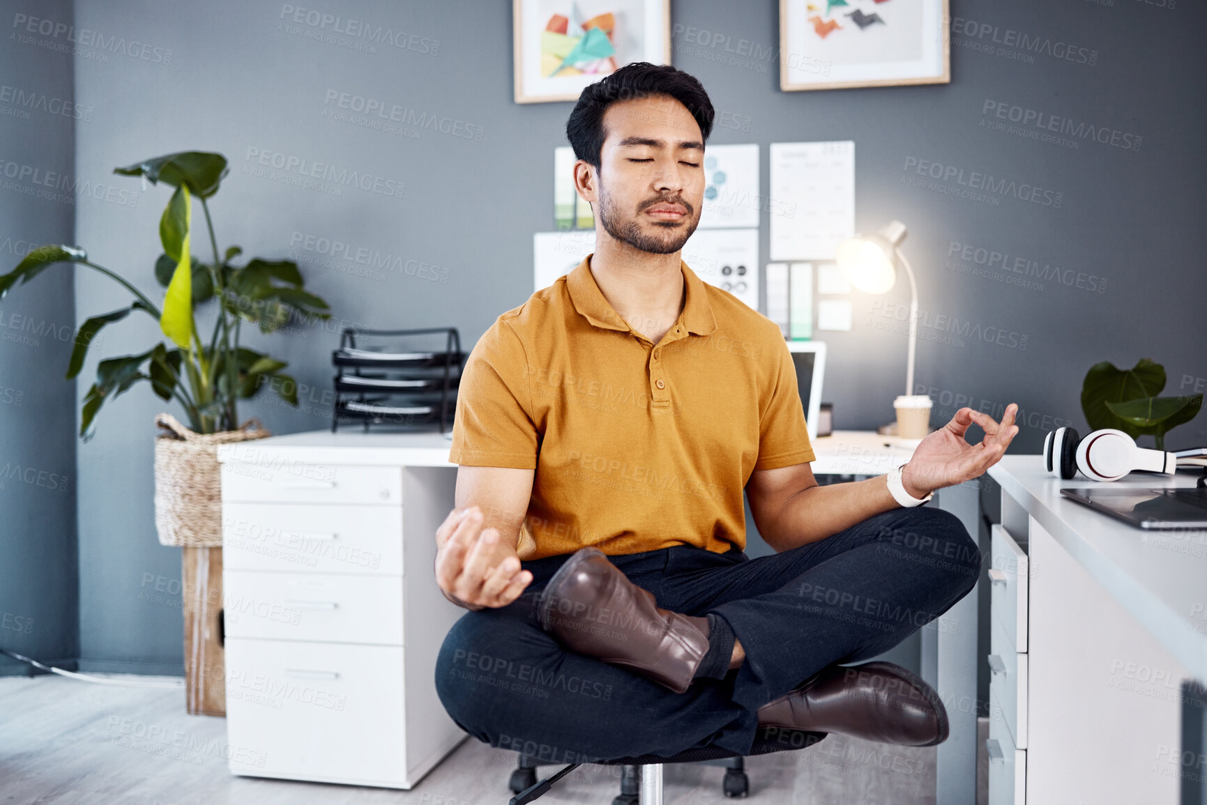 Buy stock photo Yoga, night and business man in office for mental health, relax and breathing exercise at a desk. Corporate, meditation and asian guy manager meditating for stress management, zen and peace in Japan