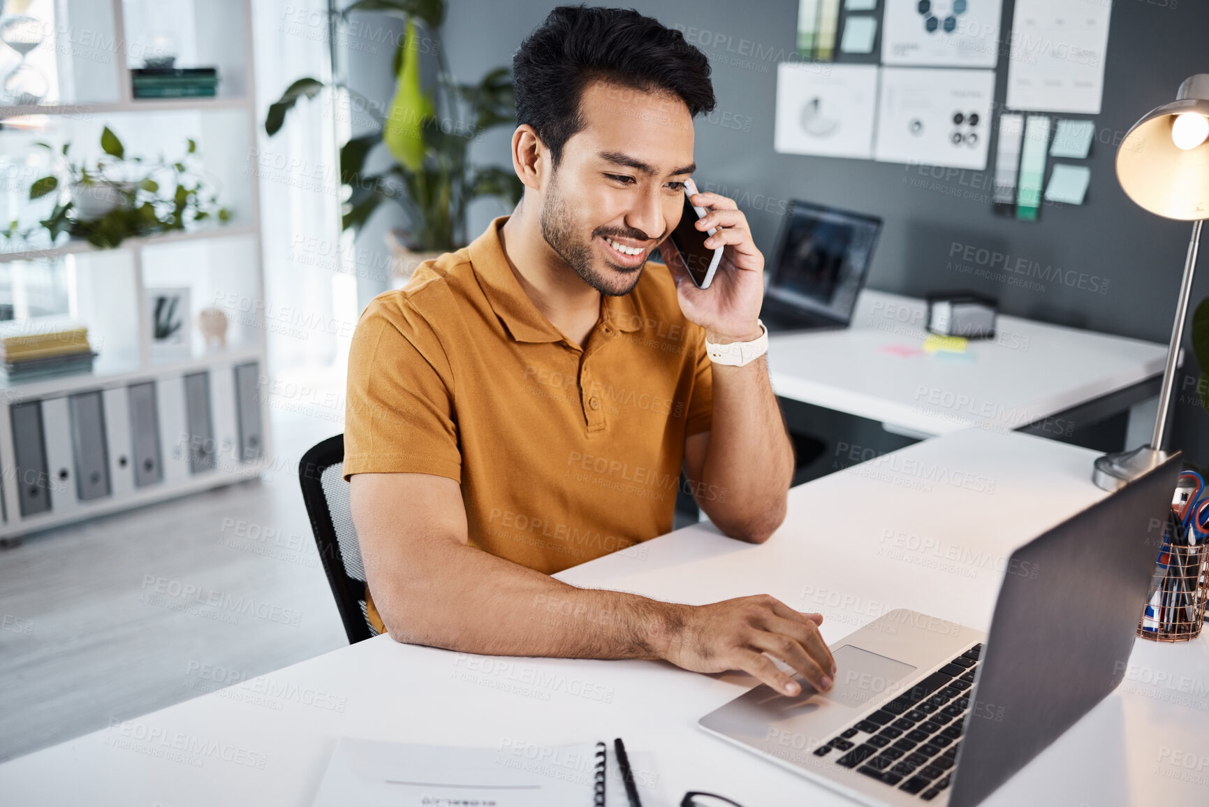 Buy stock photo Phone call, smile and strategy with a business man chatting while working at his desk in the office. Mobile, contact and communication with a young male employee chatting or networking for planning