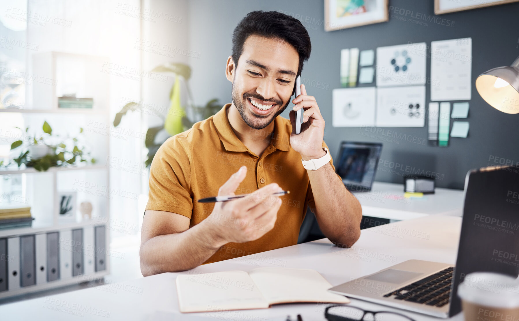 Buy stock photo Phone call, happy and strategy with a business man chatting while working at his desk in the office. Mobile, contact and communication with a young male employee chatting or networking for planning