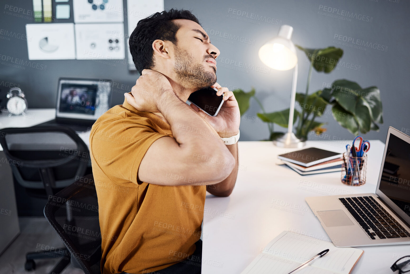 Buy stock photo Business man, phone call and neck pain or tired at office desk with a laptop and depression. Asian male entrepreneur with technology and stress, mental health or burnout and fatigue problem at night