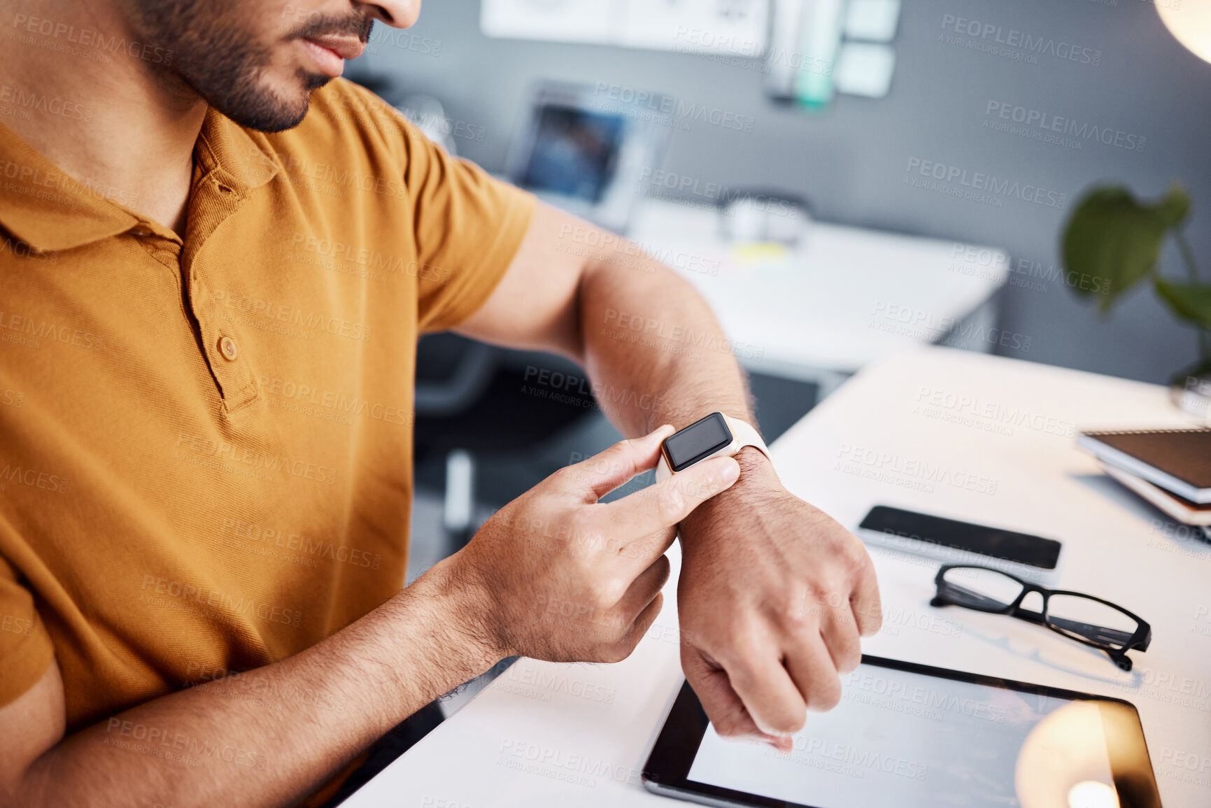 Buy stock photo Time, notification and man with a watch at work for deadline, appointment or reading a message. Digital, technology and an employee with electronics for timing, organizer and connection in office