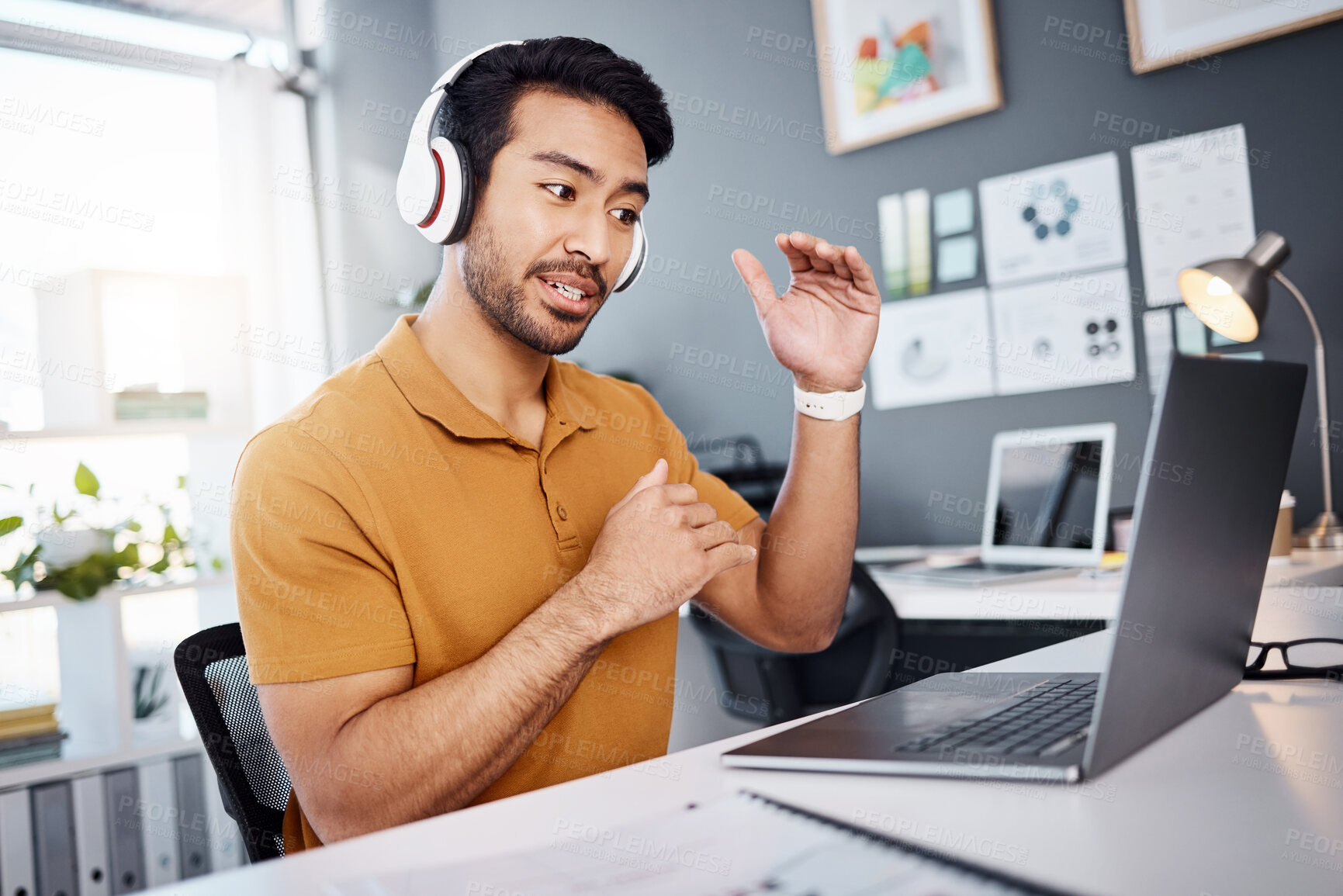 Buy stock photo Video call, laptop and man explain on webinar or virtual meeting for business planning in his office. Creative asian person with headphones on computer online discussion, speaking or client advice 