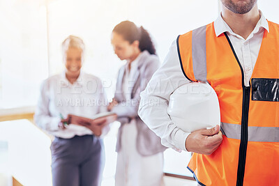 Buy stock photo Architect, safety helmet and meeting for construction planning, collaboration or management at the office. Businessman, contractor or engineer holding hard hat in leadership for architecture project