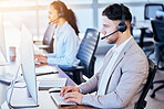 Call center, computer and typing with man in office for customer service, technical support or help desk. Telemarketing, contact us and communication with employee for legal advice, operator or focus