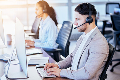 Buy stock photo Call center, computer and typing man in office for customer service, technical support and help desk. Telemarketing, contact us and communication with employee for sales advice, operator or crm focus