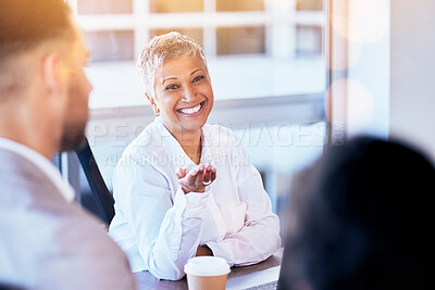 Buy stock photo Senior business woman, meeting and smile in discussion, seminar and happy for team building in office. Female manager, leader and talking to staff with happiness for workshop, planning or strategy