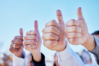 Buy stock photo Business people, hands and thumbs up for teamwork, success or winning in thank you and good job outdoors. Hand of group showing thumb emoji, yes sign or like for team approval or ok with blue sky