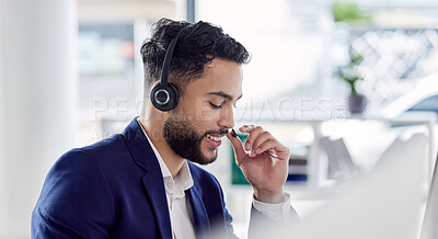Buy stock photo Customer service, support and communication with a consultant man using a headset while working in an office. Contact us, crm and consulting with a happy young male employee at work in a call center