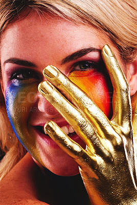Buy stock photo Gold hand, woman and beauty portrait with color paint cosmetics on skin and face in studio. Female model person with a happy smile for art deco, fantasy and creative makeup with metallic shine