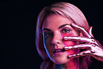Woman, metallic hand and beauty portrait with color paint cosmetics on skin and face in studio. Female model person on a black background for art deco, fantasy and creative makeup with a neon light