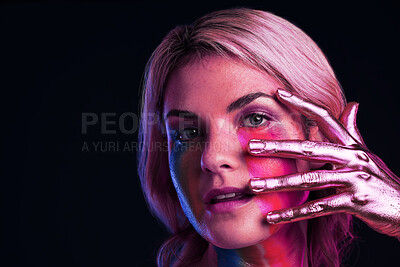 Buy stock photo Woman, metallic hand and beauty portrait with color paint cosmetics on skin and face in studio. Female model person on a black background for art deco, fantasy and creative makeup with a neon light