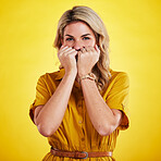 Portrait, shy and woman with fist on face in studio isolated on a yellow background. Female person, introvert and covering mouth with hands, peek and hiding, secret and embarrassed with gossip.