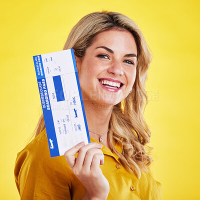 Buy stock photo Happy woman, plane ticket and smile for travel, flight or vacation against a yellow studio background. Portrait of female traveler smiling with boarding pass, passport or permit for traveling or trip