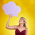 Smile, looking and woman with speech bubble in studio isolated on a yellow background. Poster, word cloud and happy female person holding advertising banner for marketing, opinion or social media.