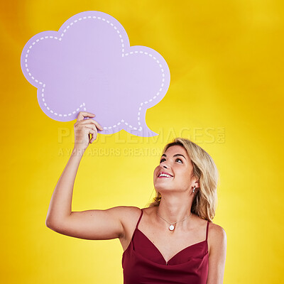 Buy stock photo Smile, looking and woman with speech bubble in studio isolated on a yellow background. Poster, word cloud and happy female person holding advertising banner for marketing, opinion or social media.