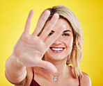 Selfie, frame and portrait of woman with hands on yellow background in trendy, stylish and modern clothes. Fashion, happiness and face of female person with palms up, confidence and happy in studio